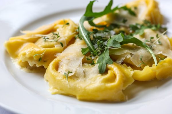 Tortelloni with Parmesan shavings and arugula